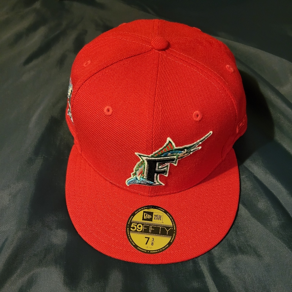 Brand new size 7 3/8 new era 59/50 fitted cap Florida Marlins in red.